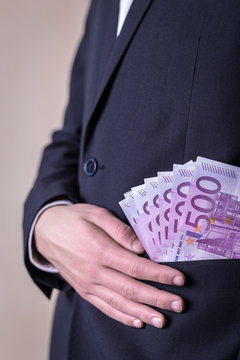Bribe and corruption with euro banknotes.