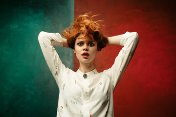 Beauty woman on a colored background. Woman surprised