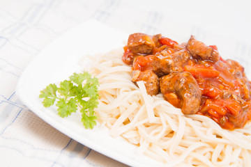 Chinese food - sweet and sour chicken with chow mein noodles