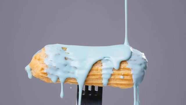 eclair pour glaze gray background