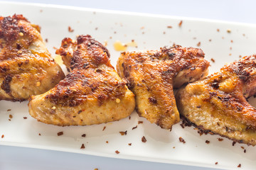 Fried chicken wings on the white plate