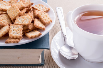 White plate with cookies on old book