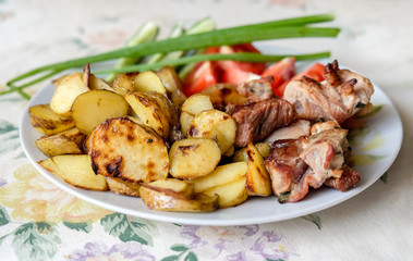 Home made barbecue meat with fried potatoes Russian style