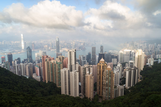 Famous view of Hong Kong's skyline as seen from the Victoria Peak in daylight.