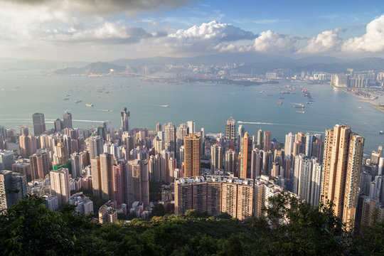 Skyscrapers and other buildings in Sai Wan and Mid Levels on Hong Kong Island and beyond in Hong Kong, China viewed from the Victoria Peak in daylight.