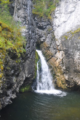Fototapeta na wymiar Waterfall in the national Park Yugyd VA.