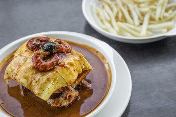 francesinha traditional meat cheese spicy sauce grilled sandwich