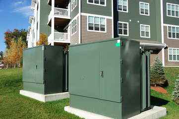 electricity distribution box outside modern apartment building