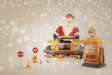 Santa stop here,Santa Claus on his classic vehicles and retro Gasoline pump.Christmas wallpaper...