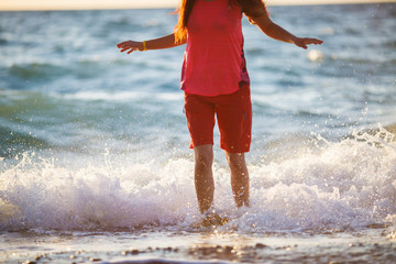 Woman standing in sea water