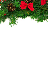 branch of Christmas tree with ribbons and pine cones on a white