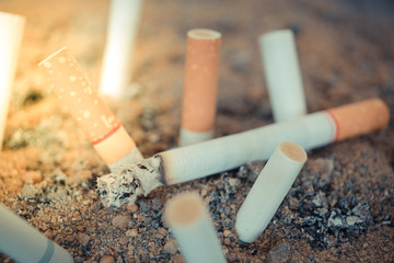 Cigarette burning in ashtray