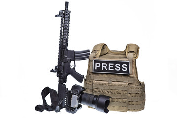 Bulletproof vest,camera and rifle.Isolated/Body armor,digital camera and assault rifle isolated on white background.
