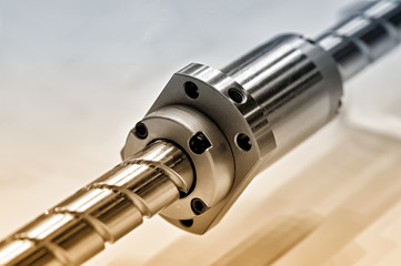 Steel rod with a screw thread and a metal round detail