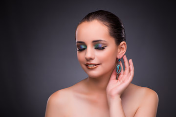 Beautiful woman with jewellery in beauty concept