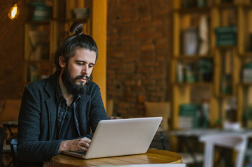 Smiling Caucasian man rewriting in social network with his frien