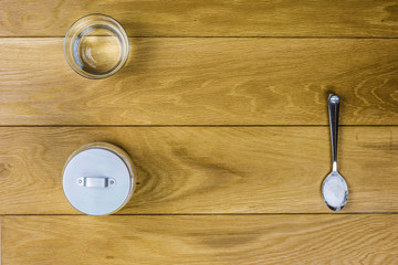 Sodium bicarbonate on wooden background