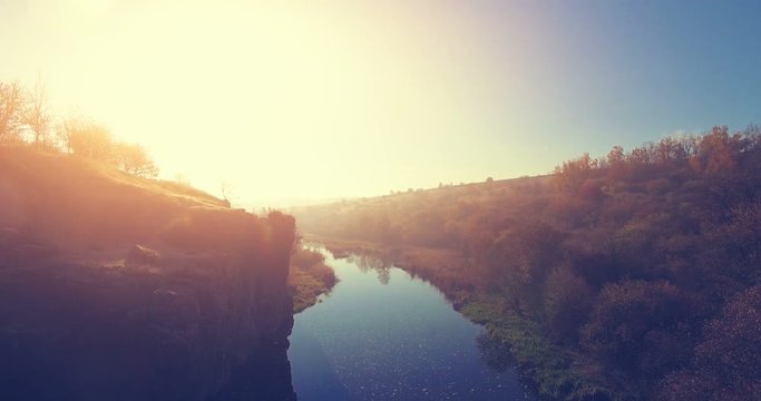 Aerial Drone Flight Footage: Picturesque view on Buky Canyon, Cherkasy region, Ukraine. Beautiful landscape in sunset glow. Camera goes down. Beauty world. 4K resolution.