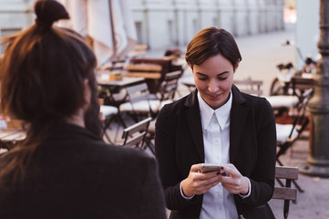 Woman texting. Closeup young happy smiling cheerful beautiful wo