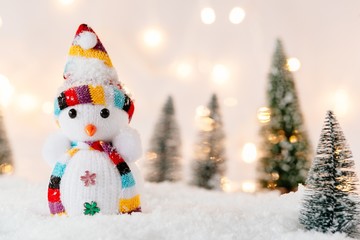 Little toy snowman in snow