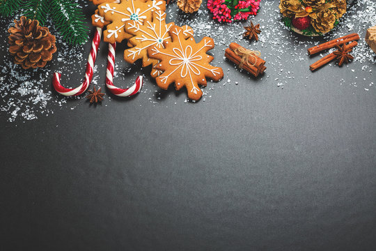 Christmas cookies with candy, cone and fir festive decoration with snow