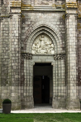 Fototapeta premium Jesus as wisdom among scholars, bas-relief above the door Chapel