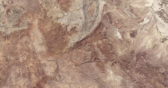 High-altitude overflight aerial of rocky desert near the Mexico/Texas border. Clip loops and is reversible. Elements of this image furnished by NASA 