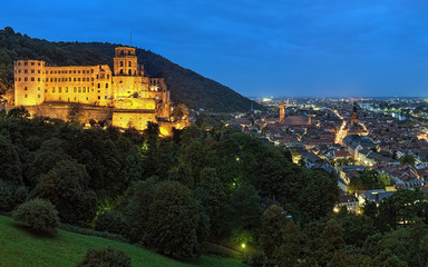 Obraz premium Evening view of Heidelberg, Germany with Heidelberg Castle, Jesuit Church and Church of the Holy Spirit