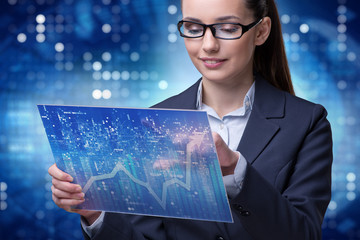 Businesswoman in stock exchange trading concept