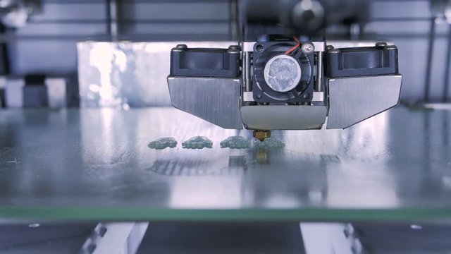 Three dimensional printer during work in laboratory, 3D plastic printer, 3D printing