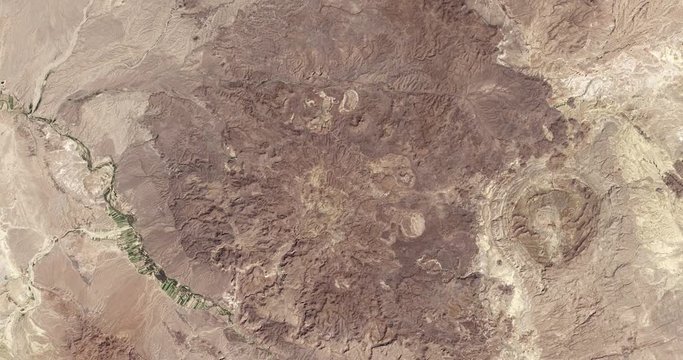 High-altitude overflight aerial of rocky desert near the Mexico/Texas border. Clip loops and is reversible. Elements of this image furnished by NASA 