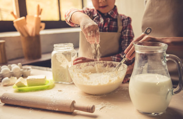 Mom and daughter baking