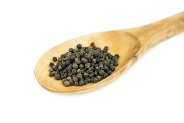 Black pepper in spoon wooden bowl isolated on white background