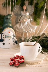 Gingerbread cookie and cup of tea. Christmas New Year holiday co