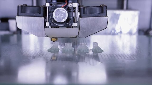 Three dimensional printer during work in laboratory, 3D plastic printer, 3D printing