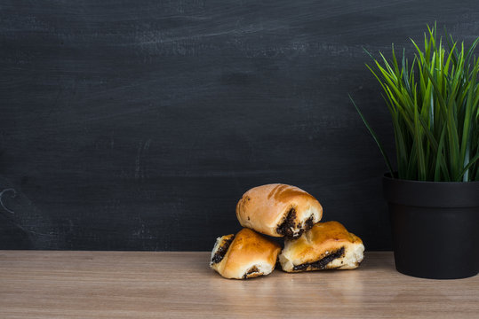 Rolls with poppy seeds and blackboard