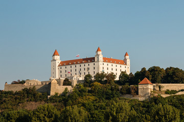 Fototapeta na wymiar Bratislava Castle with blue sky and copy space
