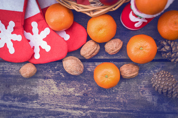 Branches of a Christmas tree on old boards. Christmas background. Christmas Socks. Christmas decorations. New Year background. Xmax background. Toned image.