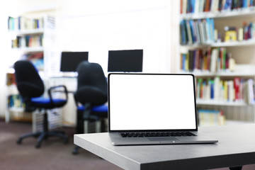 Modern laptop on table at library