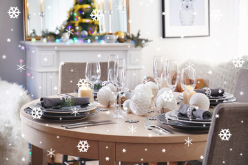 Table setting for festive Christmas dinner. Snowy effect. Christmas celebration concept.