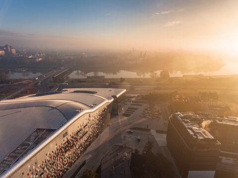 Aerial view of modern city at sunrise on the background - Wawel Castle, Ice Krakow, Poland