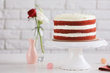 Delicious cake on white table