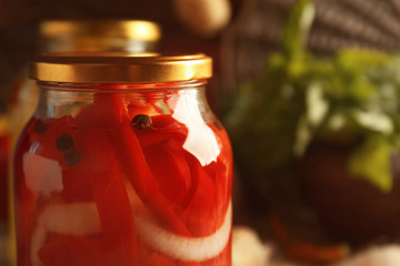 Canned red peppers in jar, closeup