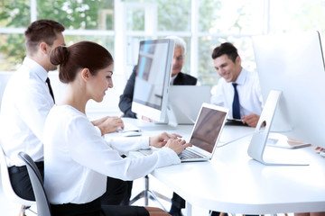 Business training concept. Colleagues working on computers at office