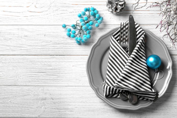 Beautiful Christmas table setting on wooden background