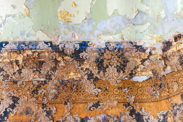 Vintage textures: old wallpaper, peeling paint, brick wall and layers of different colorful backgrounds.