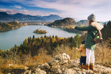 Fototapeta na wymiar Traveling family looking on Bled Lake, Slovenia, Europe