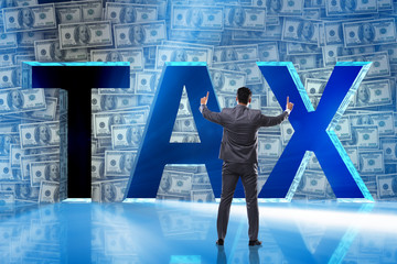 Businessman in high taxes concept