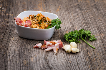 Ham with rice and assorted vegetables in natural light