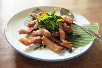 delicious fried pork on white dish. Thai food